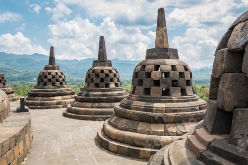 Preview: Borobudur buddhist temple with sunny and cloudy day in Yogyakarta, Java, Indonesia.