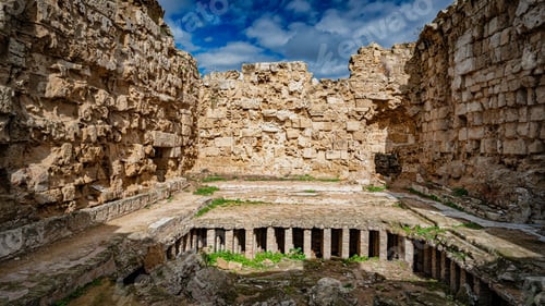 Preview: an empty pool with rocks in a courtyard next to it