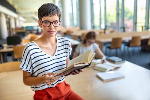 Preview: Students studying in library. Young success people are spending time together and learning together