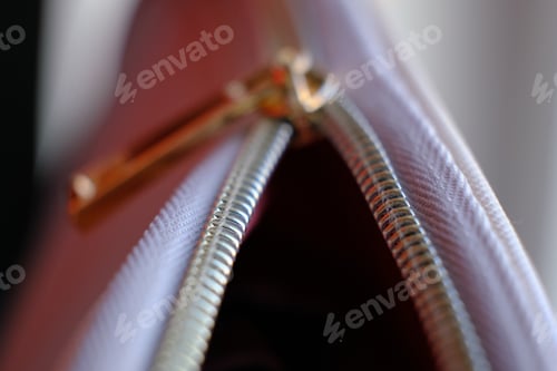 Preview: Selective focus, yellow metal zipper of a makeup bag or small purse macro pattern background