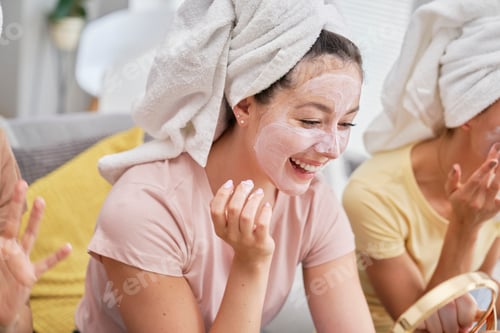 Preview: Girls having fun while applying a facial mask