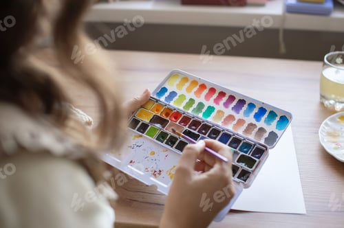 Preview: Adult Painting with Watercolors on Wooden Table