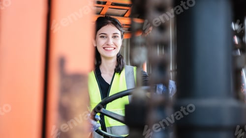 Preview: Portrait of a woman working with a forklift in a warehouse. Concept industrial and commercial.