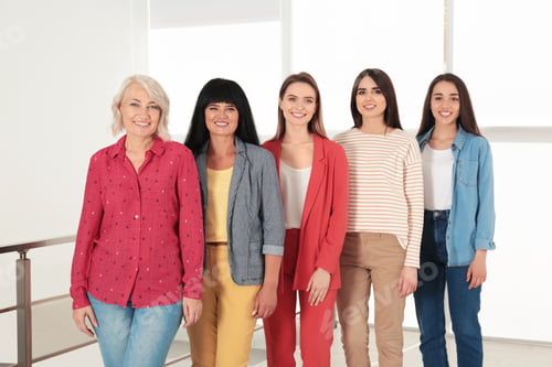 Preview: Group of ladies near window indoors. Women power concept
