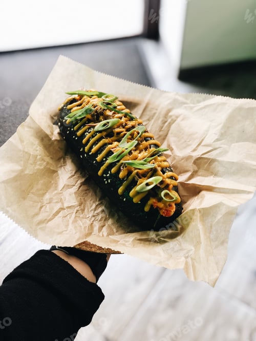 Preview: Delicious Topped Hotdog on Brown Paper