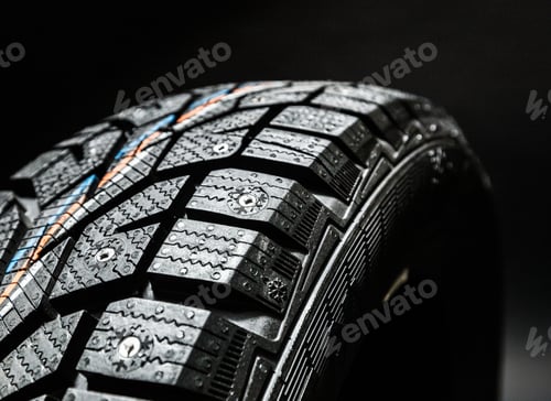 Preview: Close-up view of a winter tire showcasing its tread patterns and rubber texture