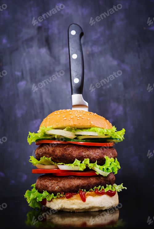 Preview: Delicious handmade burger on dark background. Close view
