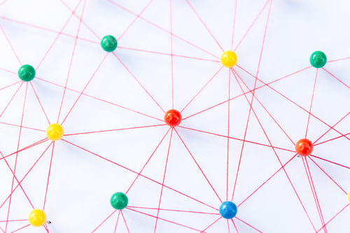 Preview: The connection between the two networks. Network simulation on paper linked together by yarn