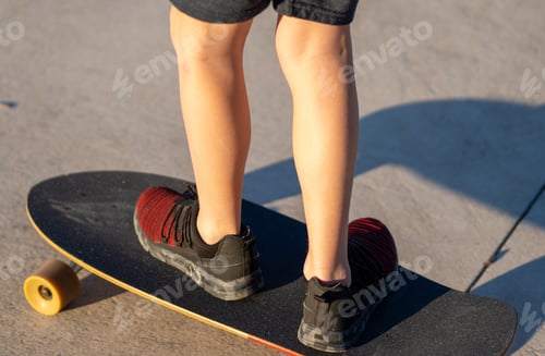Preview: Young skater boy at park riding his skateboard.