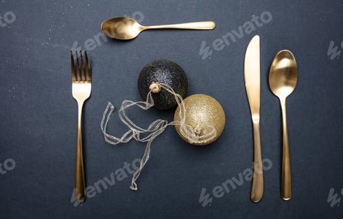 Preview: Table setting, xmas, new year. Gold cutlery on black background