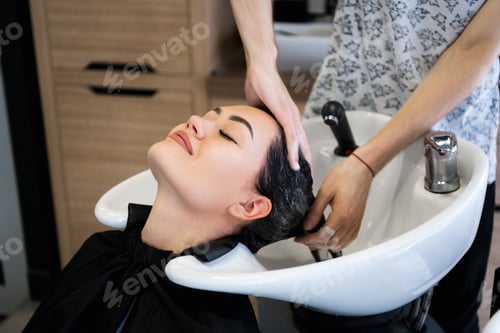 Preview: Woman Relaxing During Hair Wash at Salon