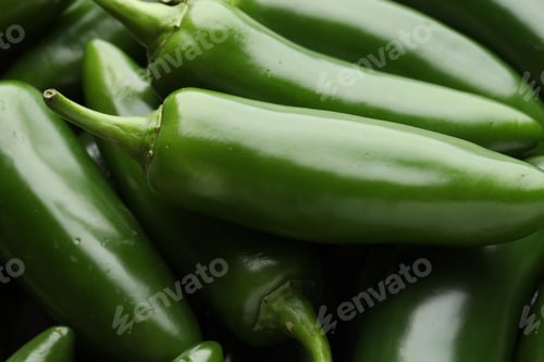 Preview: Many green jalapeno peppers as background, closeup