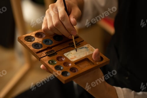 Preview: Hands holding a Paint Palette and Brush