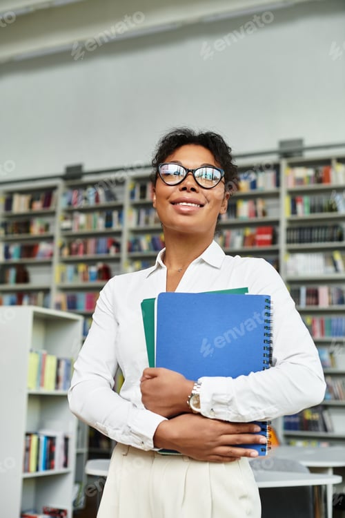 Preview: Dedicated African American teacher engaging students in a vibrant library setting