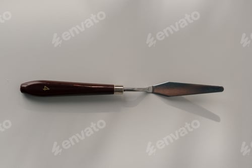 Preview: pastry spatula palette knife cooking utensils for cakes on the table on white background close-up
