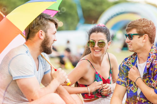 Preview: Friends at festival chatting, smiling