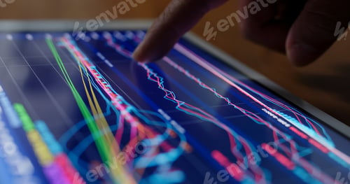 Preview: Stock market data on tablet computer at night
