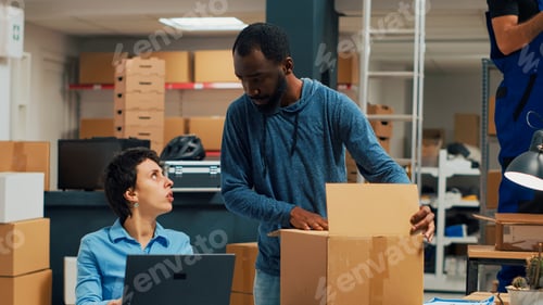 Preview: African american man signing delivery papers and shipping good