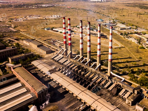 Preview: aerial power electrical plant with high industrial pipes on a summer day f