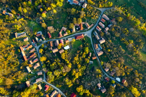 Preview: High angle aerial view of a village with winding roads