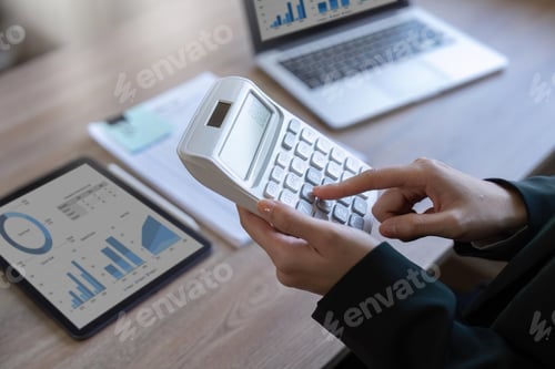 Preview: female employee working on a laptop computer in a modern office. Make an account analysis report