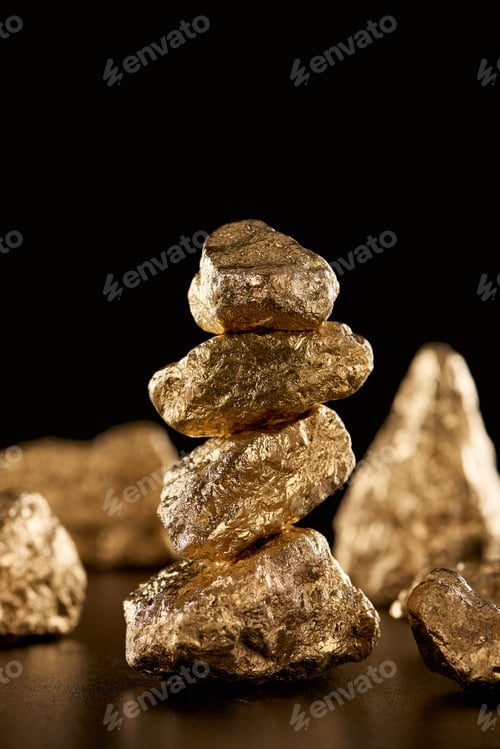 Preview: selective focus of golden shiny stones isolated on black with copy space