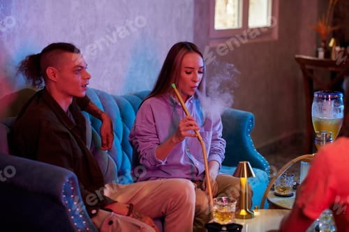 Preview: Young Woman Smoking Hookah
