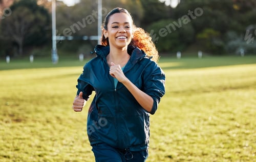 Preview: Woman, running and training outdoor on field with smile, fitness and health in sunshine with vision