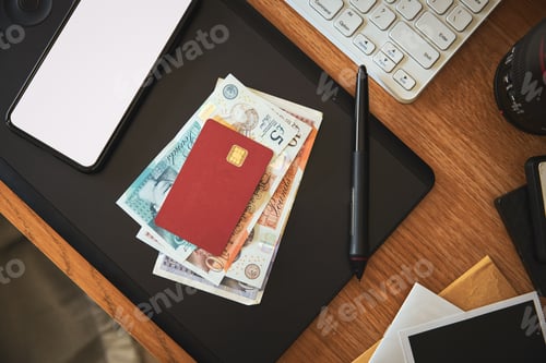 Preview: Debit card on pile of cash