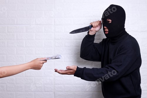 Preview: a robber holding a knife asking for money