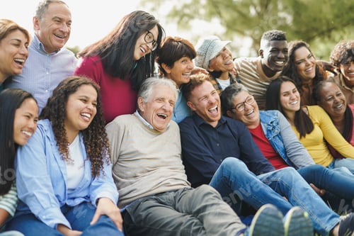 Preview: Crowd of multiracial people having fun together at city park