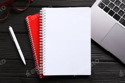 Preview: Open blank notebook, pen, laptop and glasses on black wooden table, flat lay