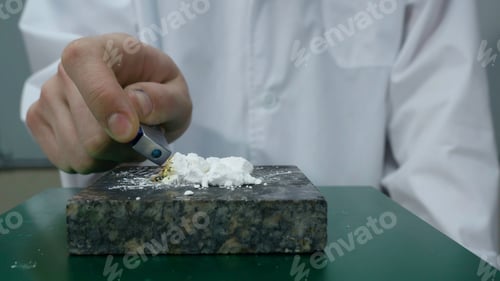 Preview: Chemist or medical research scientist adds fire to a violent chemical reaction. Chemical experience