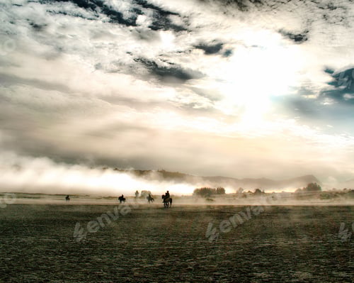 Preview: People riding horses on a field full of ashes from the Mount Bromo in Indonesia