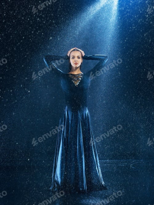 Preview: The young beautiful modern dancer dancing under water drops