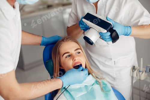 Preview: Beautiful girl sitting in the dentist's office