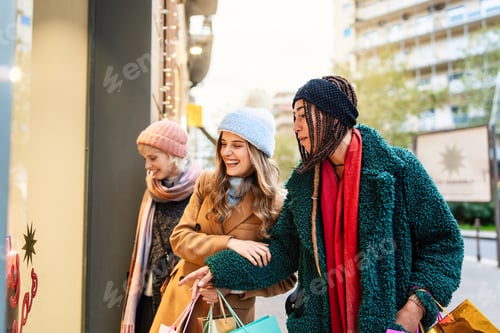 Preview: Diverse friends window shopping during winter, urban lifestyle and fashion concept
