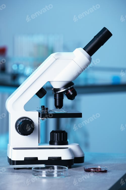 Preview: Modern medical microscope on gray table in laboratory