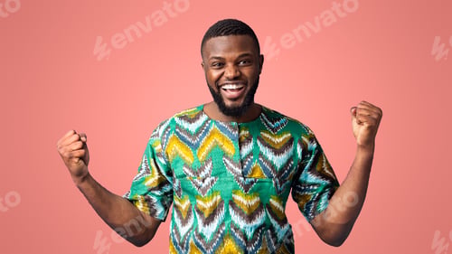 Preview: Emotional black man in colorful shirt expressing happiness
