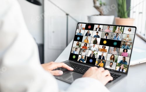 Preview: Woman Hands Using Laptop With Group of People on Screen