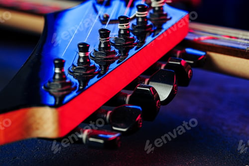 Preview: Guitar headstock with tuners on dark background