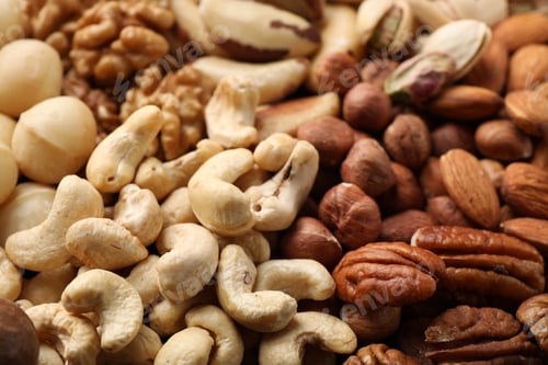 Preview: Mix of different nuts as background, closeup