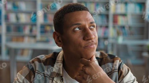 Preview: African American man male student library knowledge think contemplation new idea inspiration guy