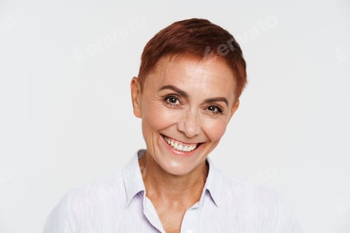 Preview: Ginger senior woman with short hair smiling and looking at camera