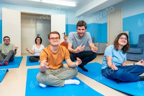 Preview: Yoga instructor directing a class with people with special needs
