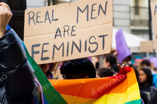 Preview: Gay young adult with lgbtq flag and feminist message