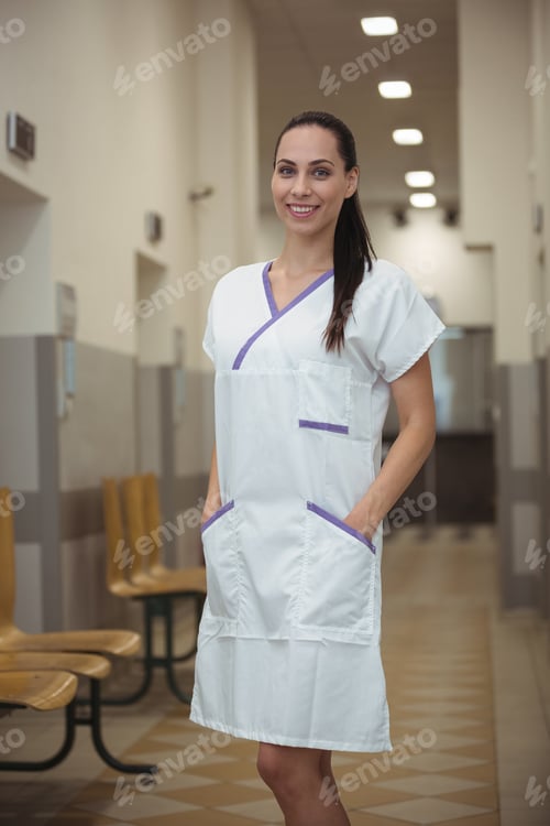 Preview: Portrait of female nurse standing in corridor