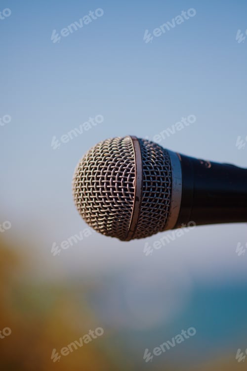Preview: Microphone on blue sky background