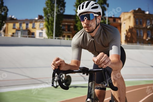 Preview: Bicyclist holding hands on steering wheel driving bike