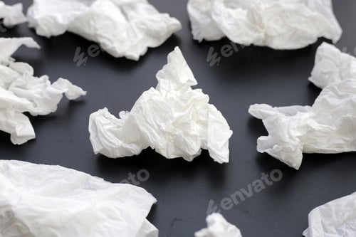 Preview: Crumpled tissue paper. Facial tissue on dark background.